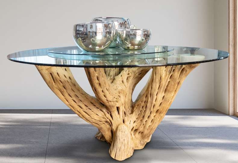 Cactus wood dining table with round glass top and blown glass bowls