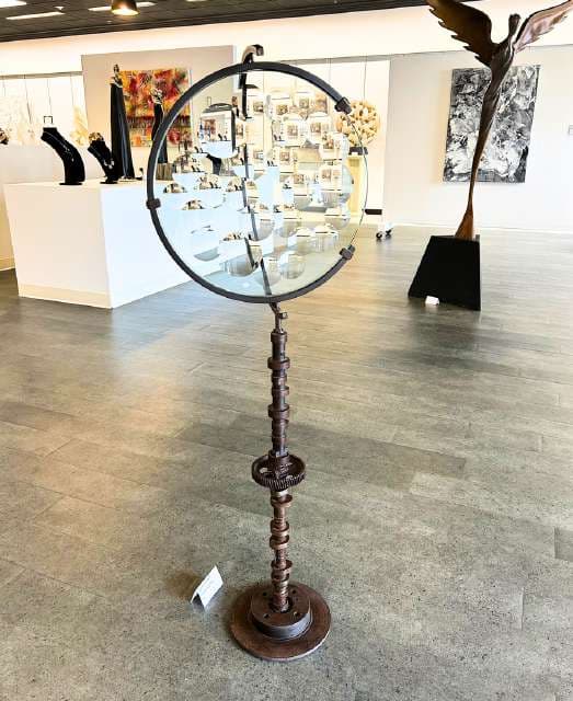 Glass magiscope with metal base on the gallery floor