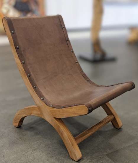 Handmade leather and parota wood butaque chair at El Dorado Gallery